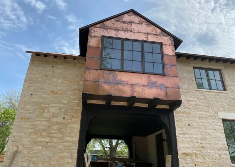 Copper metal panel facade on a stone building for Roof Repair in Apache Junction